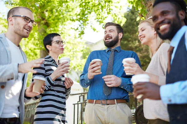 Cheerful employees with coffee — Stock Photo, Image