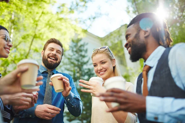 Cheerful employees with coffee — Stock Photo, Image