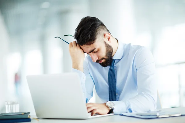 Tired businessman at workplace — Stock Photo, Image