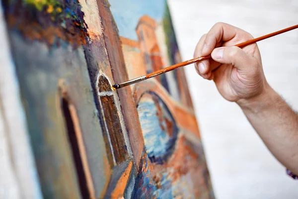 Male artist painting his picture — Stock Photo, Image