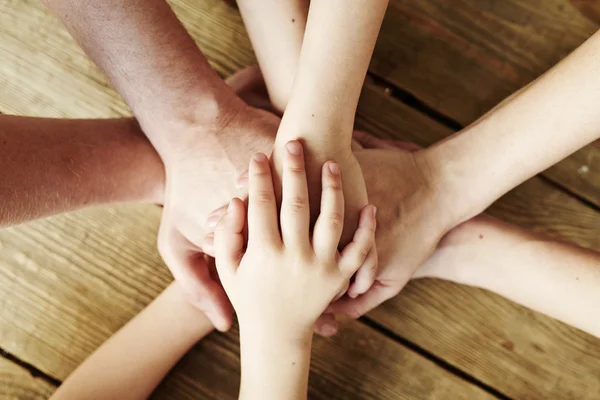 Hands making pile — Stock Photo, Image