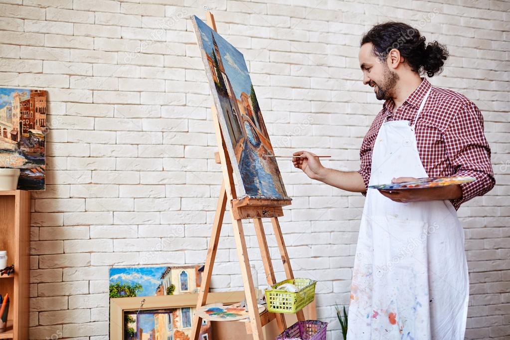 Professional artist painting picture Stock Photo by ©pressmaster 112531298