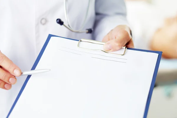 Hands with medical document — Stock Photo, Image