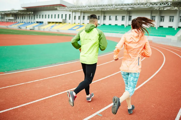 Runners training at stadium — Stock Photo, Image