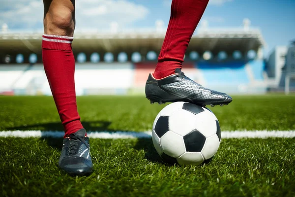 Legs in football boots — Stock Photo, Image