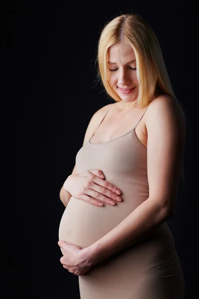 Žena dotýká břicho — Stock fotografie