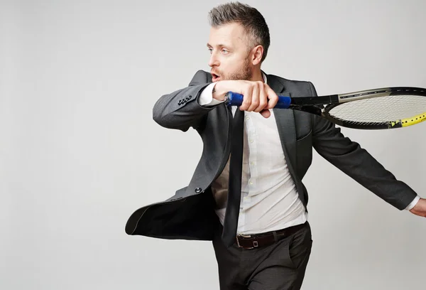 Businessman with tennis racket — Stock Photo, Image