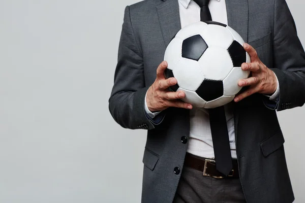 Soccer ball in hands — Stock Photo, Image