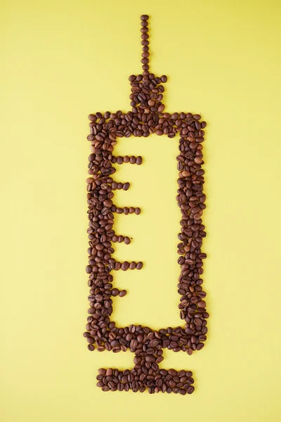 注射器的咖啡粒 — 图库照片