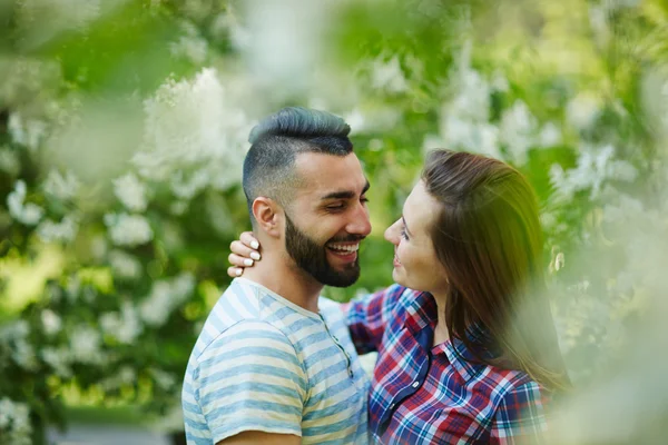 Couple and blossoming trees — Stock Photo, Image