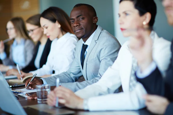 Managers listening to speaker — Stock Photo, Image