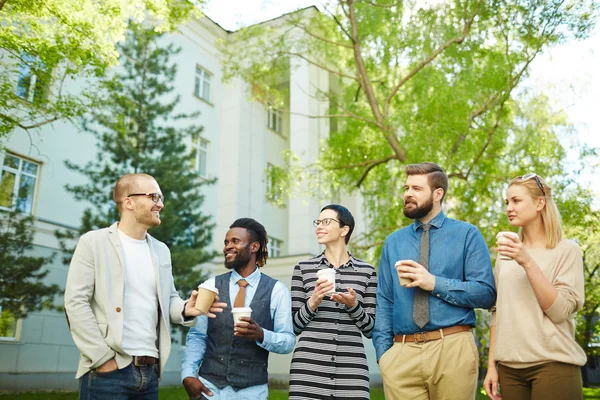 Cheerful colleagues with coffee — Stock Photo, Image