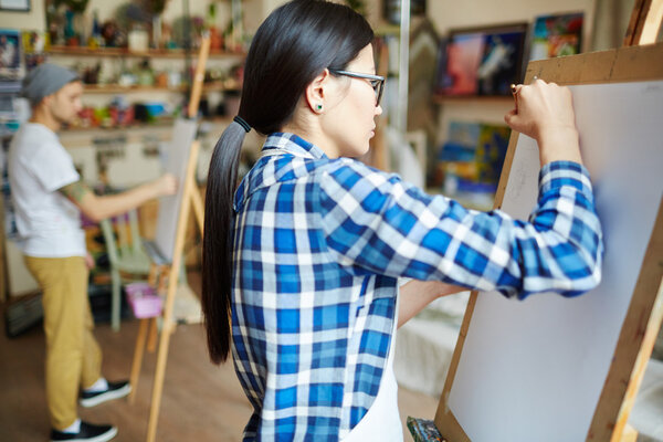 Students drawing sketch with pencil