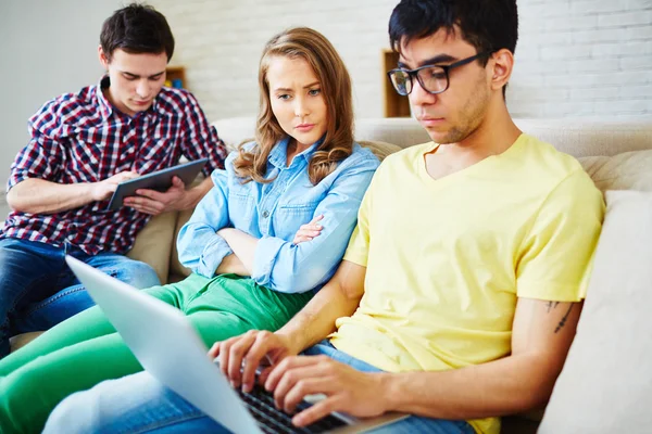 Girl looking at busy guy — Stock Photo, Image