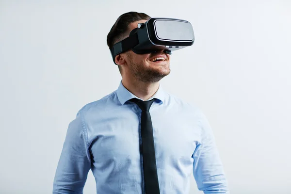 Young businessman trying vr goggles