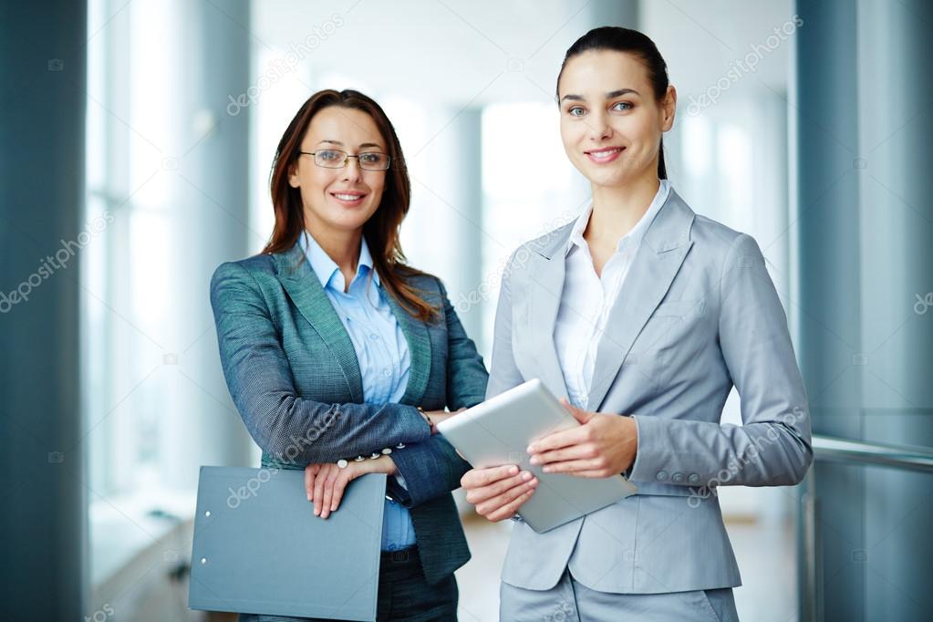 Young businesswomen looking at camera