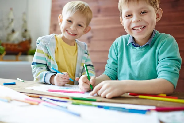 Two brothers coloring pictures