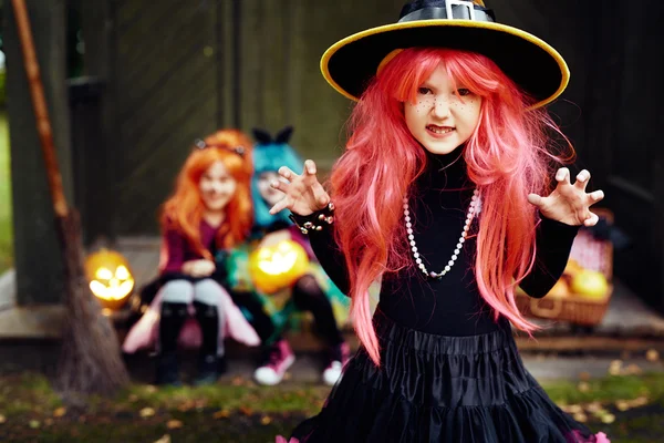 Girl in red wig frightening people — Stock Photo, Image