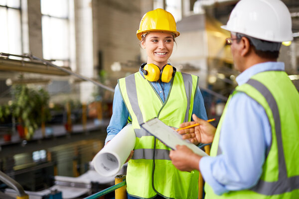 engineers in uniform and protective helmets