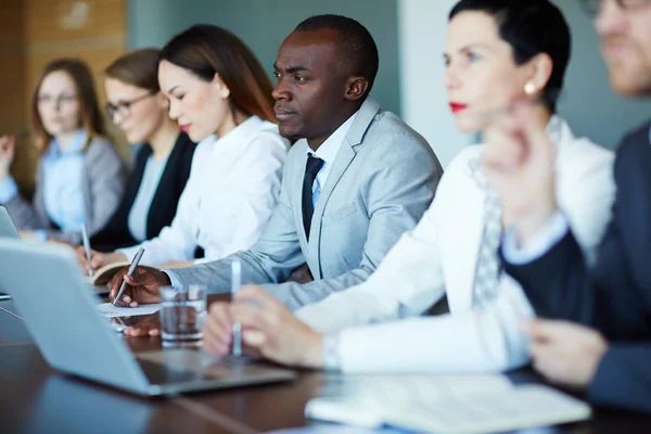 Managers listening to speaker — Stock Photo, Image