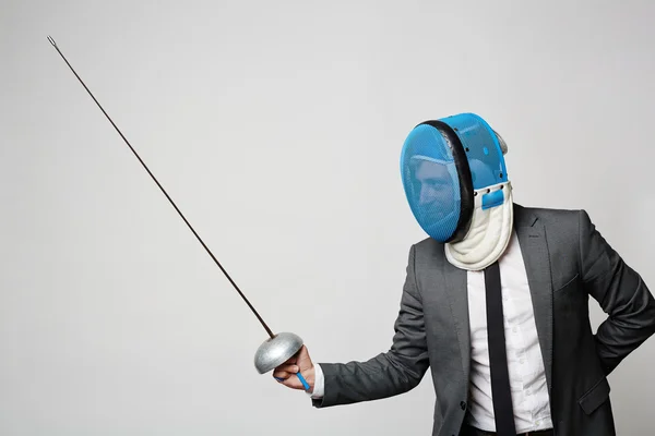 Businessman in fencing mask — Stock Photo, Image