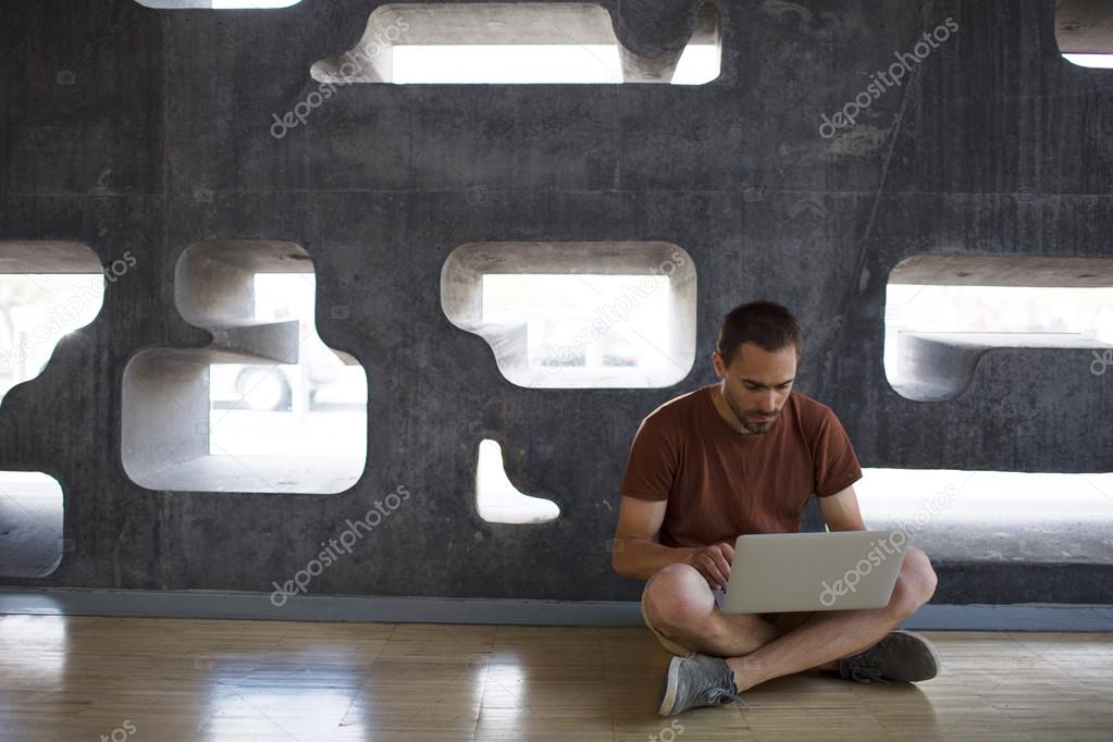 Man networking inside modern building 