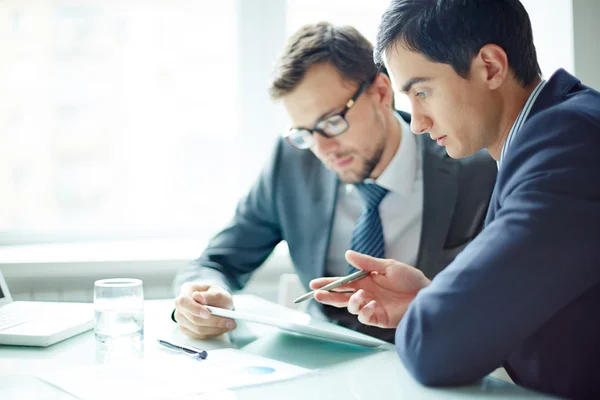 Businessmen using digital tablet on meeting — Stock Photo, Image