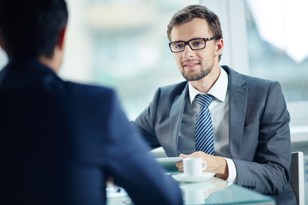 Young businessman communicating with his partner