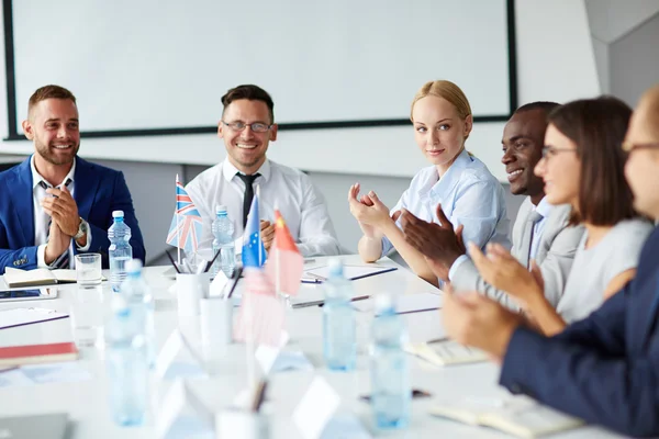 Successful professionals applauding after speech — Stock Photo, Image