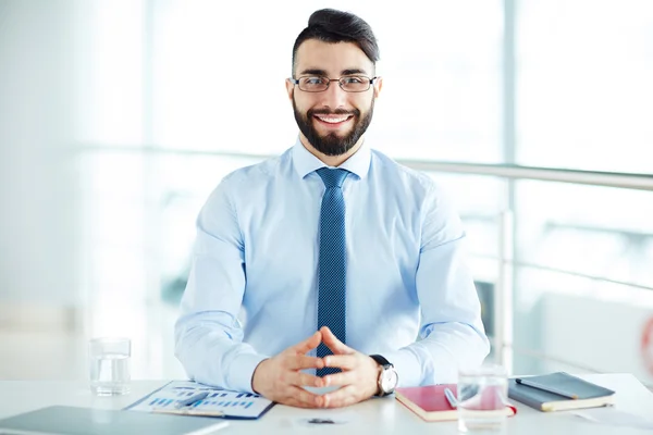 Smiling businessman at office — Stock Photo, Image