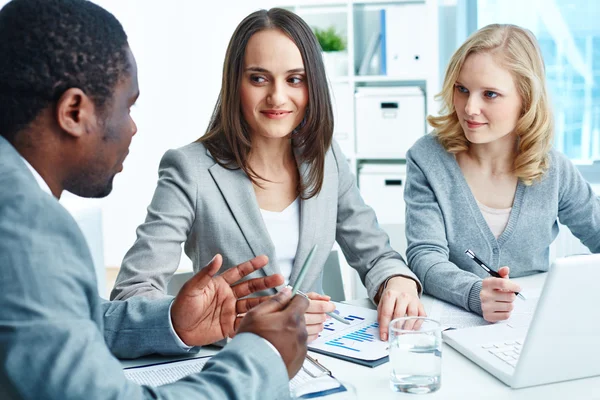 Businesspeople working with documents together Royalty Free Stock Photos