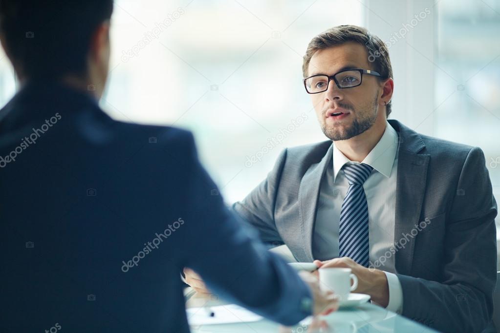 Businessman having an interview with colleague