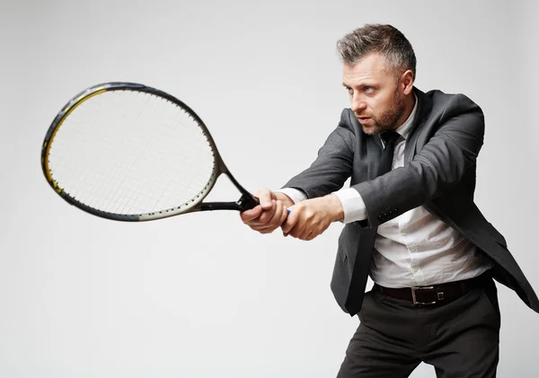 Businessman playing tennis — Stock Photo, Image