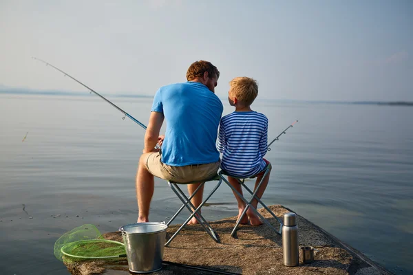 Boy and his father with rods — Stock Photo, Image