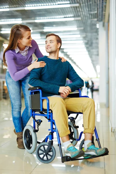 Loving Woman Supporting Handicapped Husband — Stock Photo, Image