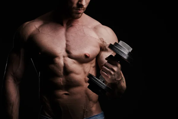 Muscular bodybuilder guy doing exercises — Stock Photo, Image