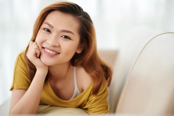 Girl lying on sofa — Stock Photo, Image