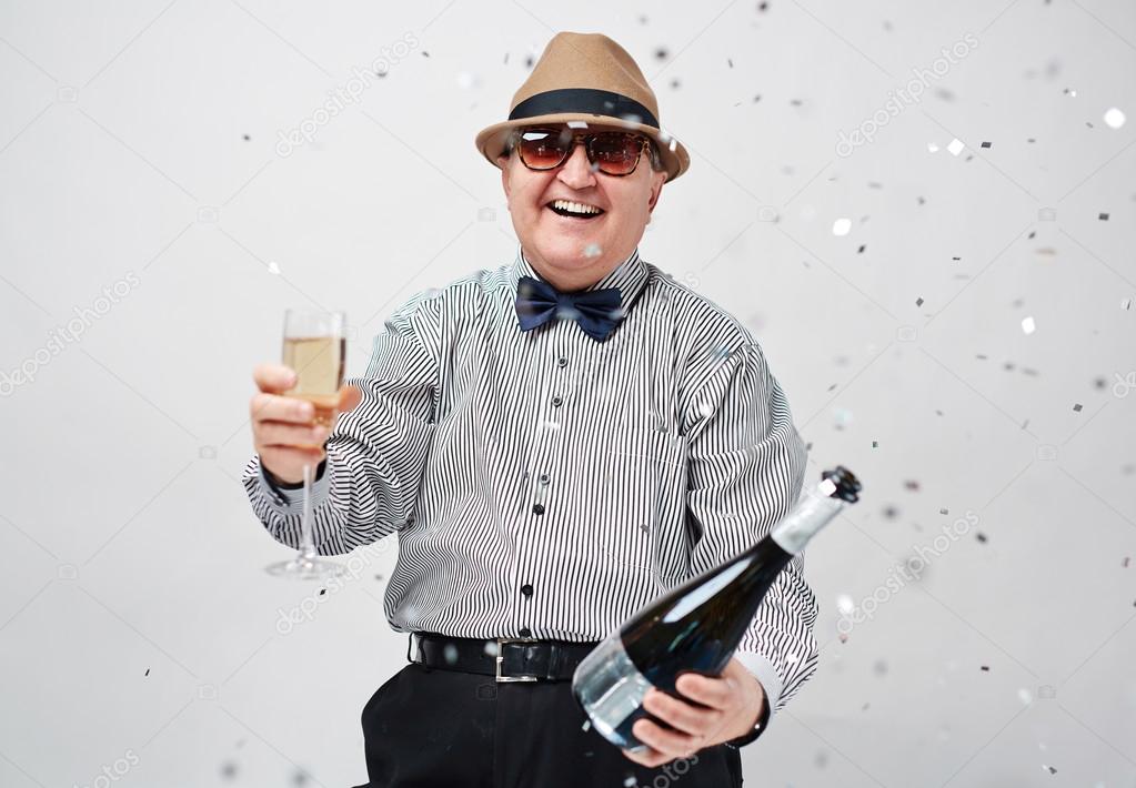 Laughing man toasting 