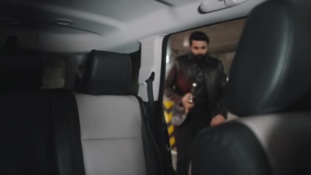 Bearded Middle Eastern Gangster Getting Back Seat Holding Pistol Trying — Stock Video