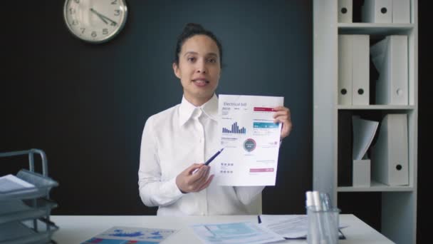 Medium Footage Smiling Mixed Raced Woman Sitting Office Holding Papers — Stock Video