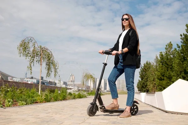 Young Businesswoman Casualwear Sunglasses Standing Electric Scooter Urban Environment Houses — Stock Photo, Image