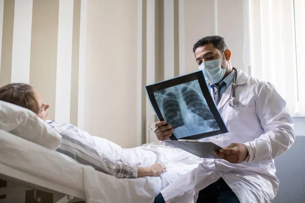 Young Radiologist Whitecoat Protective Mask Looking Lung Ray Image Sick — Stock Photo, Image