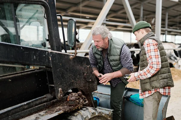 Concentrated Mature Man Beard Analyzing Reason Tractor Breakdown While Repairing — Stock Photo, Image