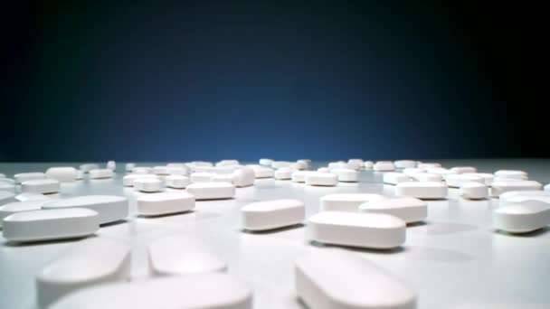 Conceptual Dollying Macro Studio Shot Many White Oval Pills Lying — Vídeo de stock