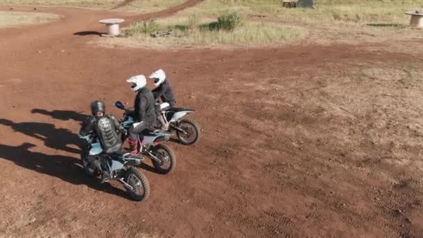 Drone Shot Men Helmets Riding Gear Sitting Motorcycles Road Track — Stock Video