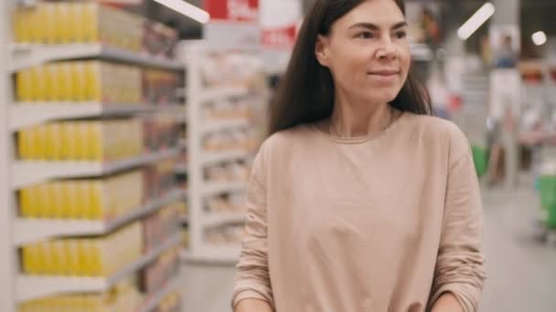 Tilting Medium Footage Young Caucasian Woman Cart Doing Daily Shopping — Stockvideo