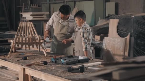 Medium Shot Happy Father Son Spending Time Together Carpentry Workshop — Vídeo de Stock