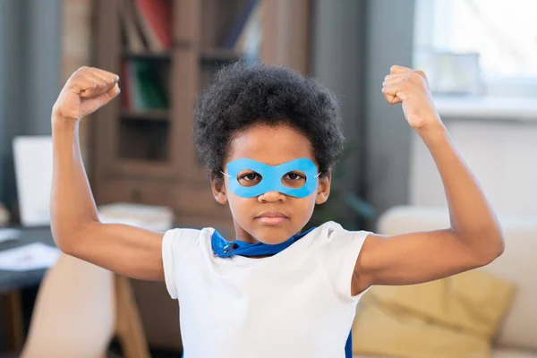 Cute Mixed Race Boy Costume Superhero Showing His Strength While — Foto Stock