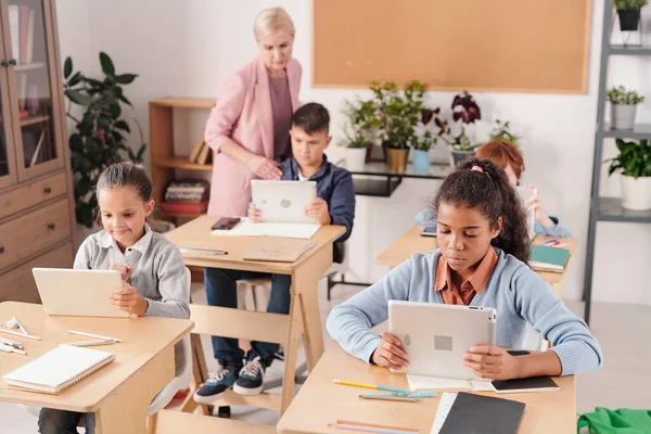 Group Contemporary Schoolchildren Tablets Sitting Desks Two Rows Working Individually — Stock Photo, Image