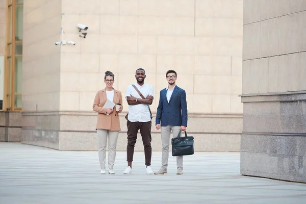 Three Young Intercultural Business Partners Smart Casualwear Standing Wall Large — Fotografia de Stock